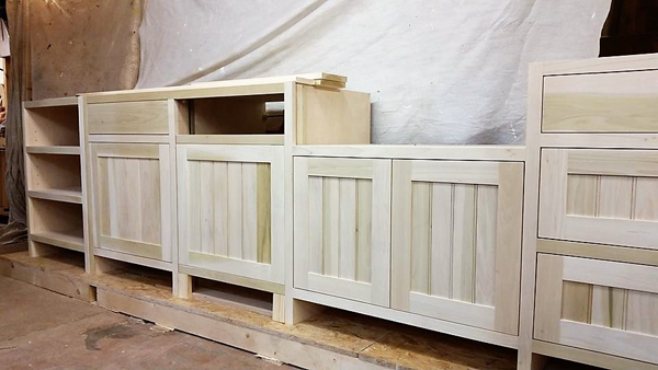 Kitchen units in Tulip Wood under construction in our workshop