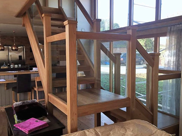 Oak open riser staircase with glass balustrade Stratford Upon Avon Warwickshire